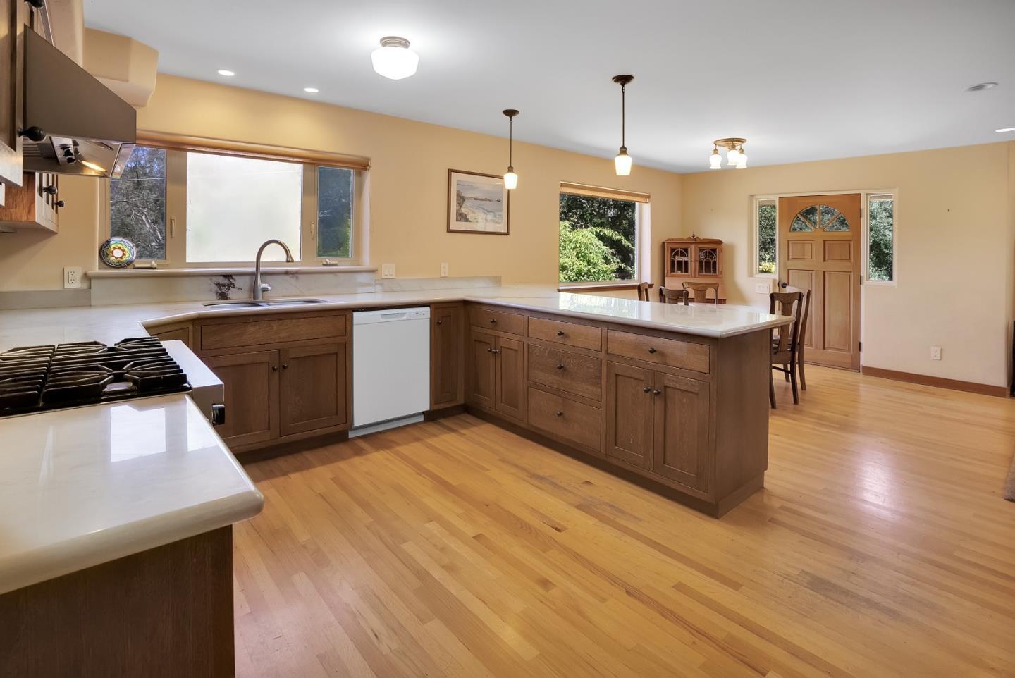 151 Rancho Road Watsonville, CA 95076 - Photo 21 of 56 a kitchen with stainless steel appliances granite countertop a sink a stove and a wooden floors