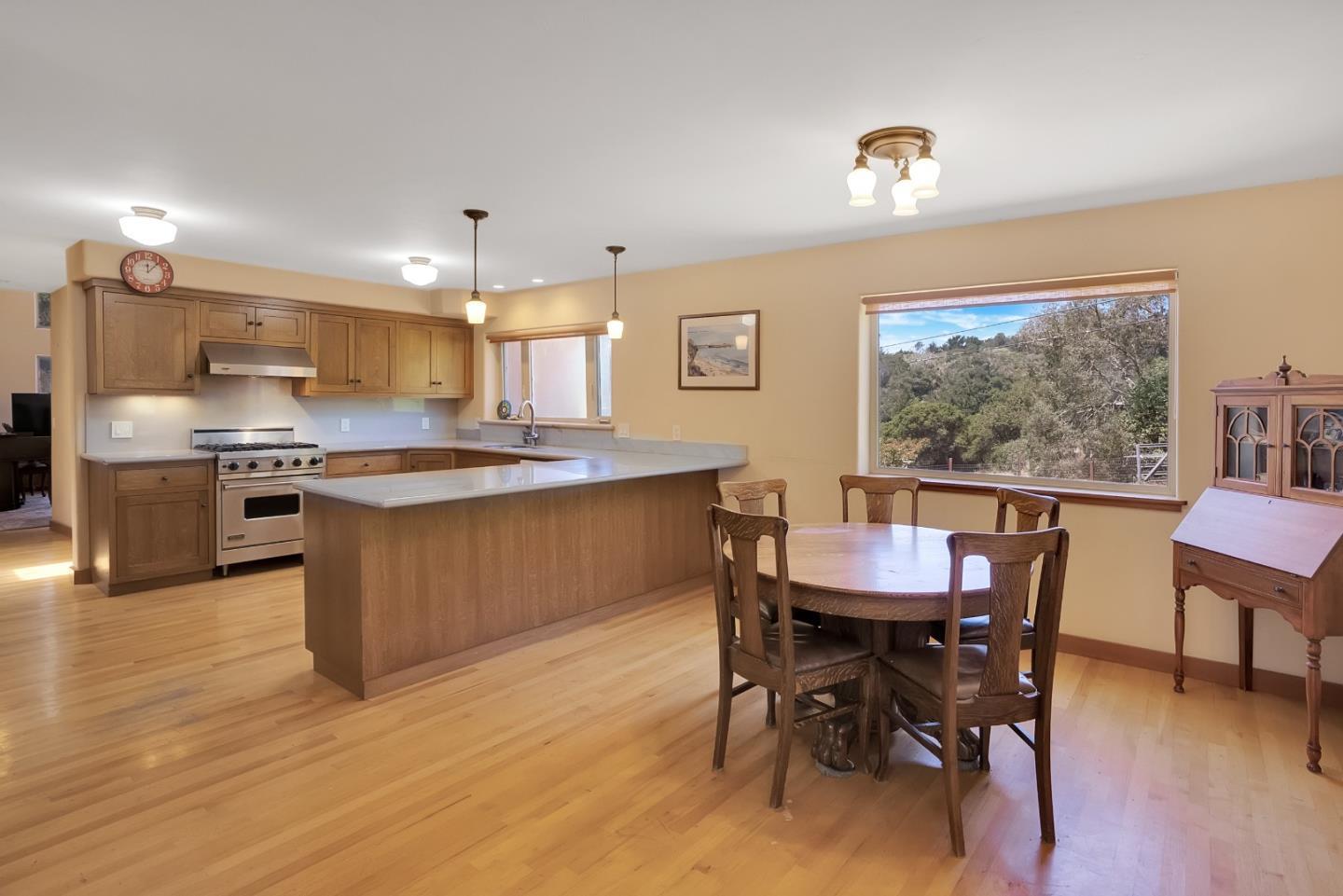151 Rancho Road Watsonville, CA 95076 - Photo 25 of 56 a view of a dining room with furniture window and wooden floor