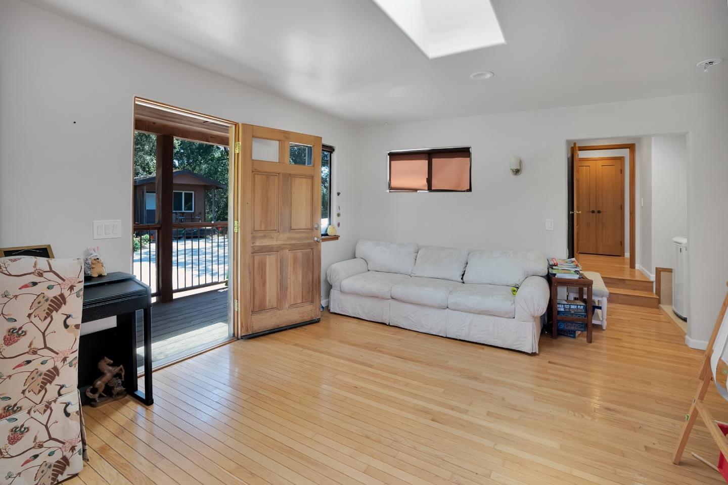 151 Rancho Road Watsonville, CA 95076 - Photo 34 of 56 a living room with furniture and a wooden floor