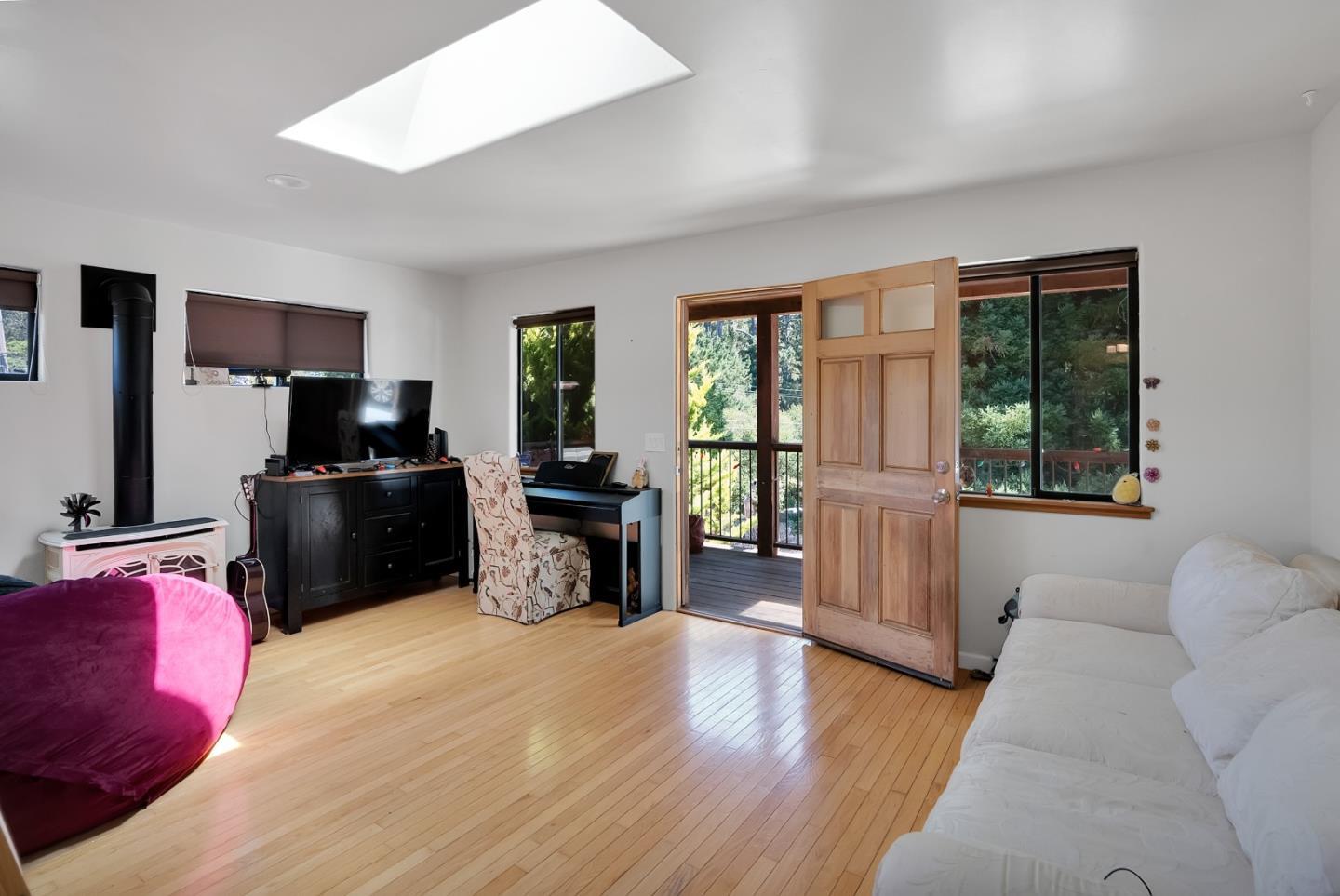 151 Rancho Road Watsonville, CA 95076 - Photo 35 of 56 a living room with furniture and a flat screen tv