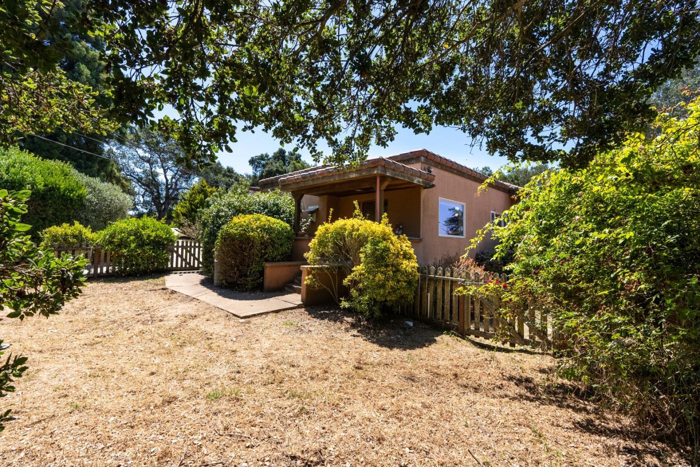 151 Rancho Road Watsonville, CA 95076 - Photo 4 of 56 a front view of a house with a yard and garage
