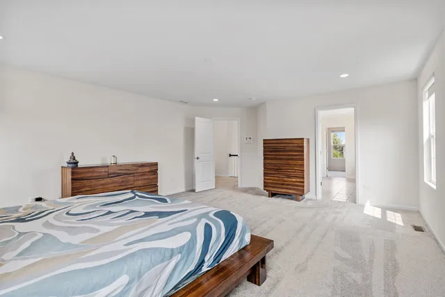 a bedroom with a bed and a television