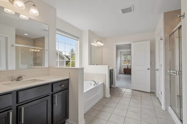 a bathroom with a sink a vanity and a mirror