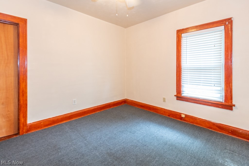 917 Helmsdale Road Cleveland Heights, OH 44112 - Photo 22 of 28 Unfurnished room featuring baseboards and carpet