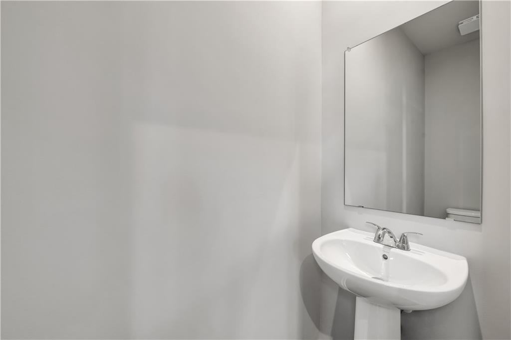 660 Devon Alley Acworth, GA 30102 - Photo 18 of 32 a bathroom with a sink and a mirror