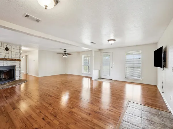 a view of a livingroom with wooden floor