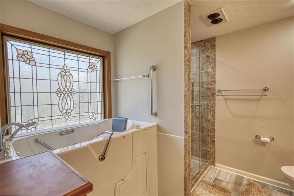 2740 Dennard Road Northeast Conyers, GA 30013 - Photo 24 of 51 a bath tub sitting next to a blue sink