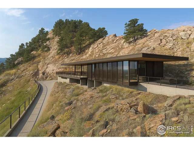 a living room with furniture and large windows