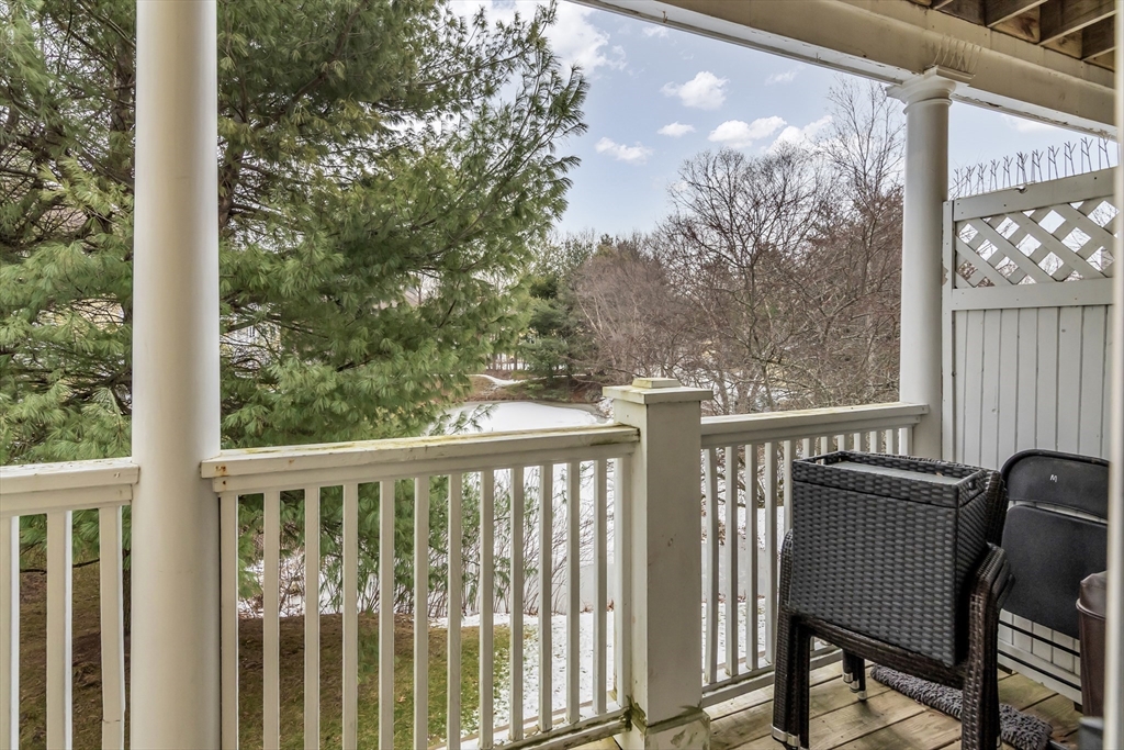 1 Riverview Boulevard, Unit 7204 Methuen, MA 01844 - Photo 11 of 29 a view of a chair and table in the balcony