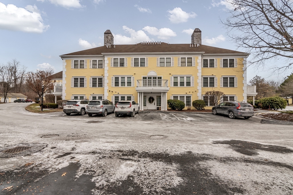 1 Riverview Boulevard, Unit 7204 Methuen, MA 01844 - Photo 2 of 29 a front view of a building with cars parked