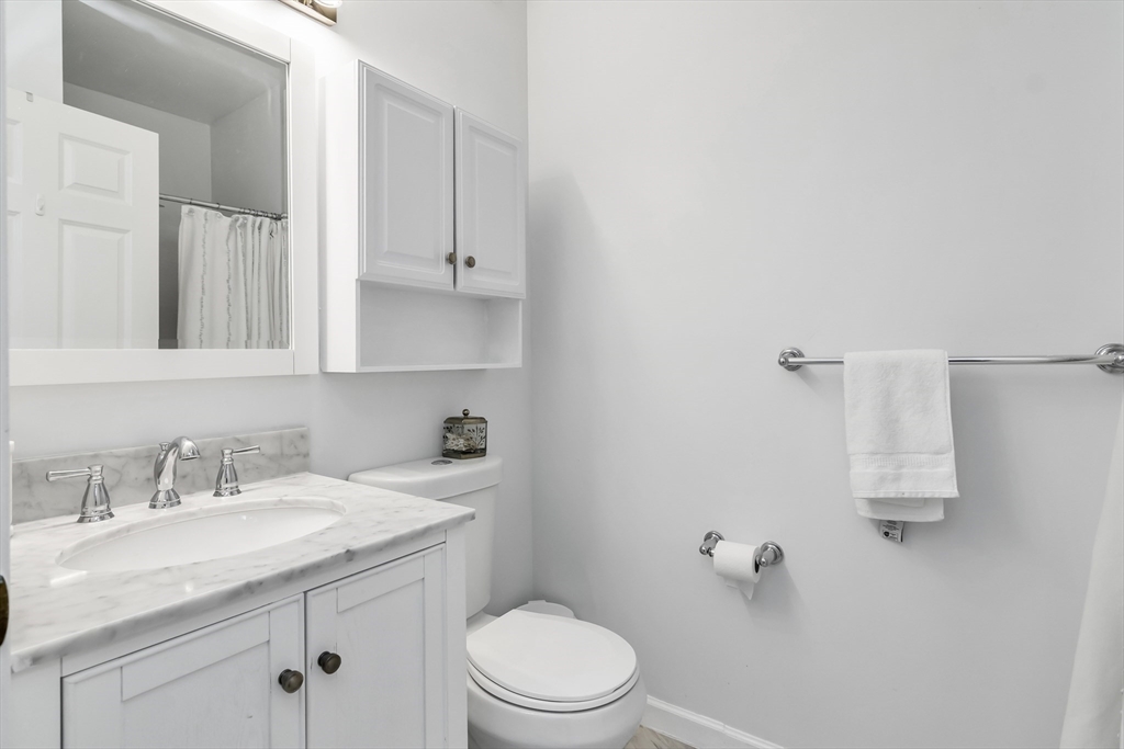 1 Riverview Boulevard, Unit 7204 Methuen, MA 01844 - Photo 24 of 29 a bathroom with a sink toilet and vanity
