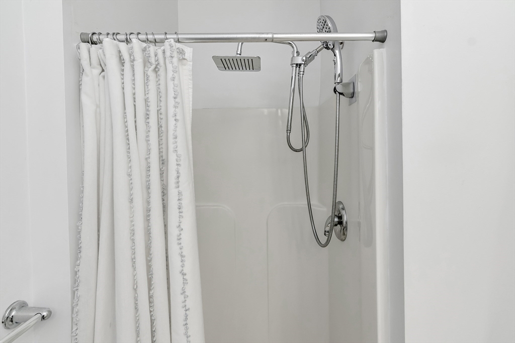 1 Riverview Boulevard, Unit 7204 Methuen, MA 01844 - Photo 25 of 29 a bathroom with a shower