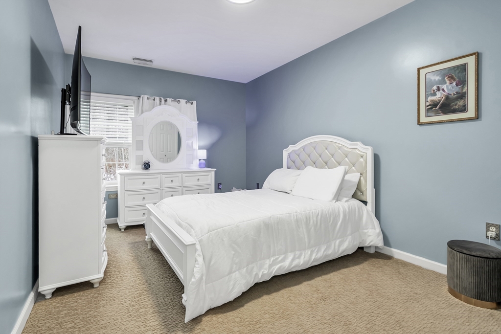 1 Riverview Boulevard, Unit 7204 Methuen, MA 01844 - Photo 26 of 29 a bed room with a bed and a painting