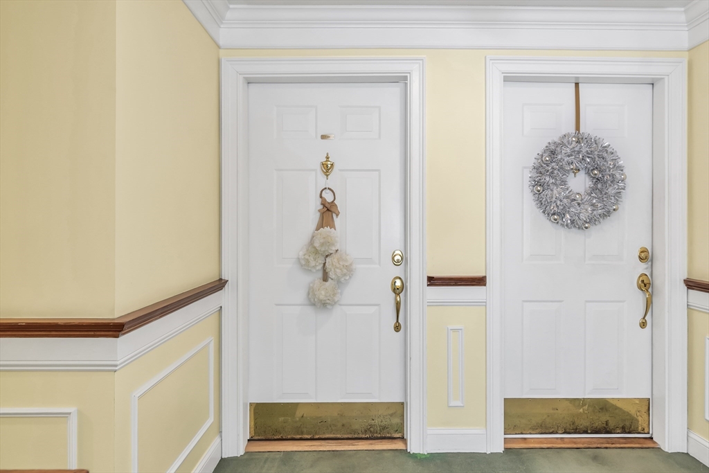 1 Riverview Boulevard, Unit 7204 Methuen, MA 01844 - Photo 4 of 29 a view of a hallway with wooden floor and entryway