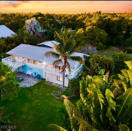 a dining room with furniture and chandelier
