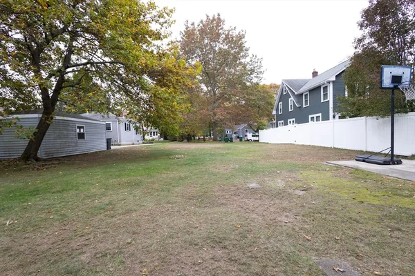 a front view of house with yard and trees