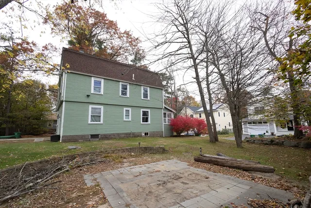 a house that has a tree in front of it