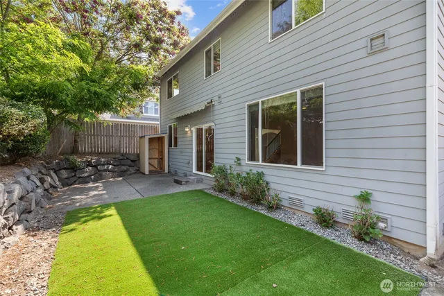 a view of a house with a backyard