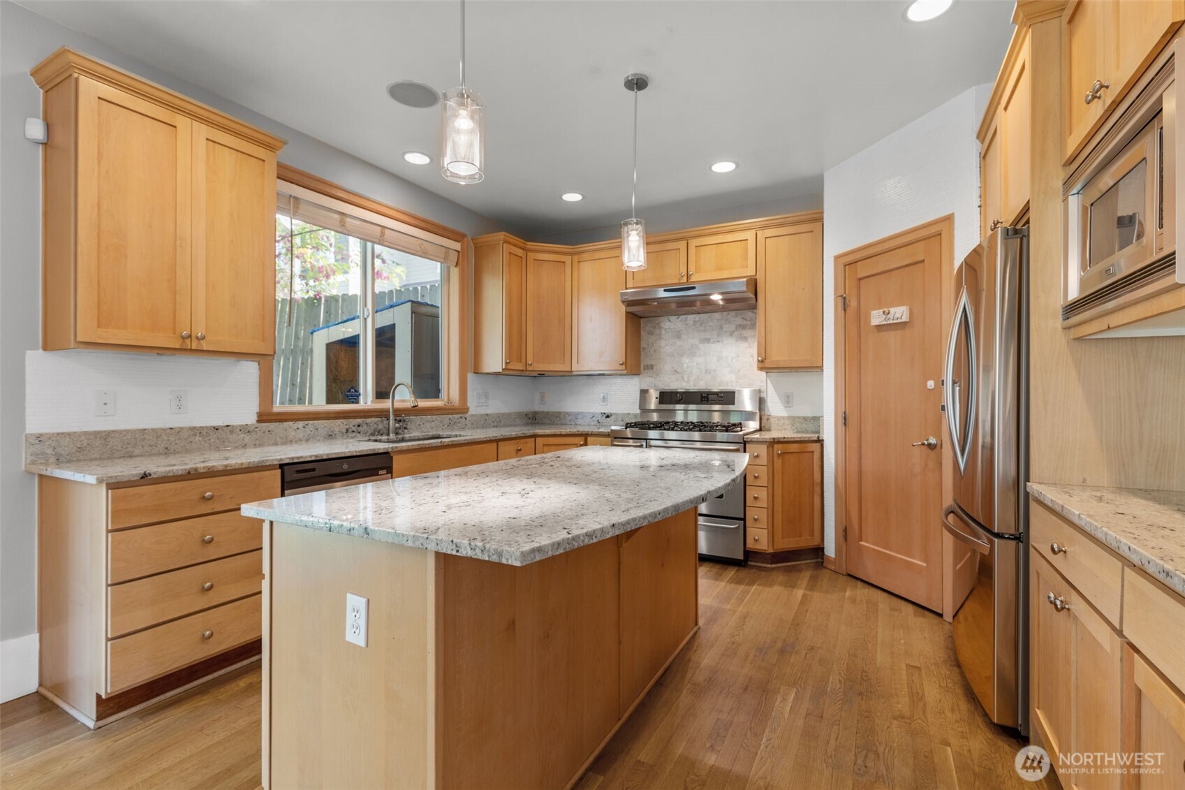 2528 Camas Avenue Northeast Renton, WA 98056 - Photo 23 of 28 a kitchen with a stove a sink and a refrigerator