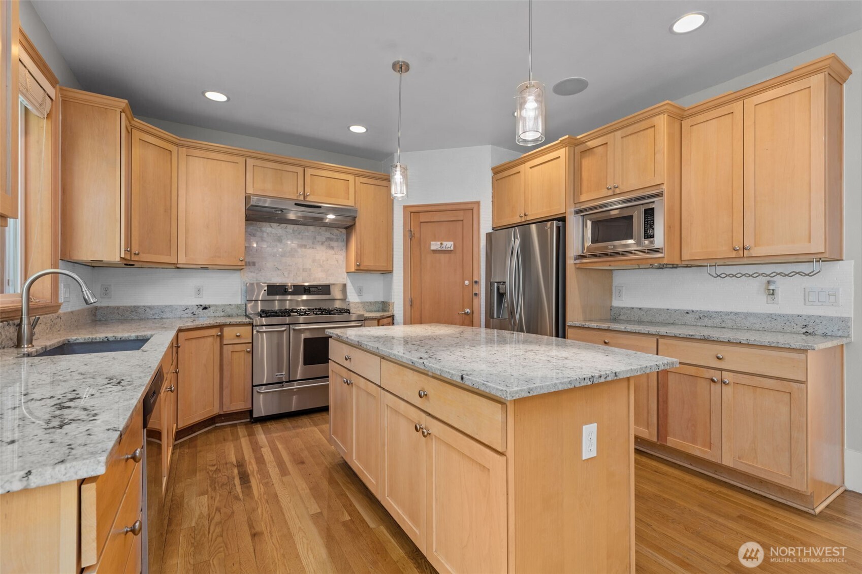 2528 Camas Avenue Northeast Renton, WA 98056 - Photo 24 of 28 a kitchen with stainless steel appliances granite countertop a sink stove and refrigerator