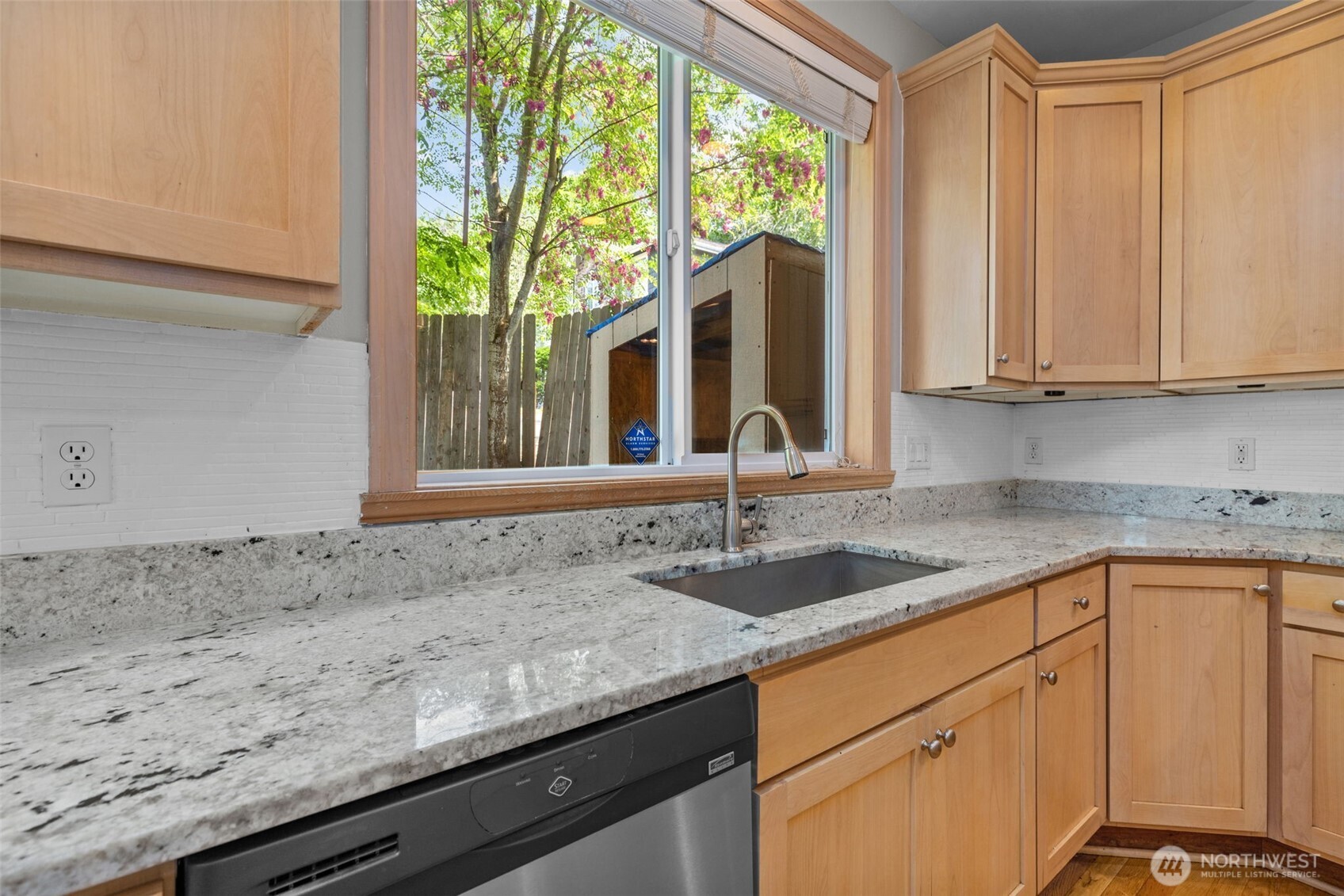 2528 Camas Avenue Northeast Renton, WA 98056 - Photo 25 of 28 a kitchen with granite countertop a sink a counter top space and cabinets
