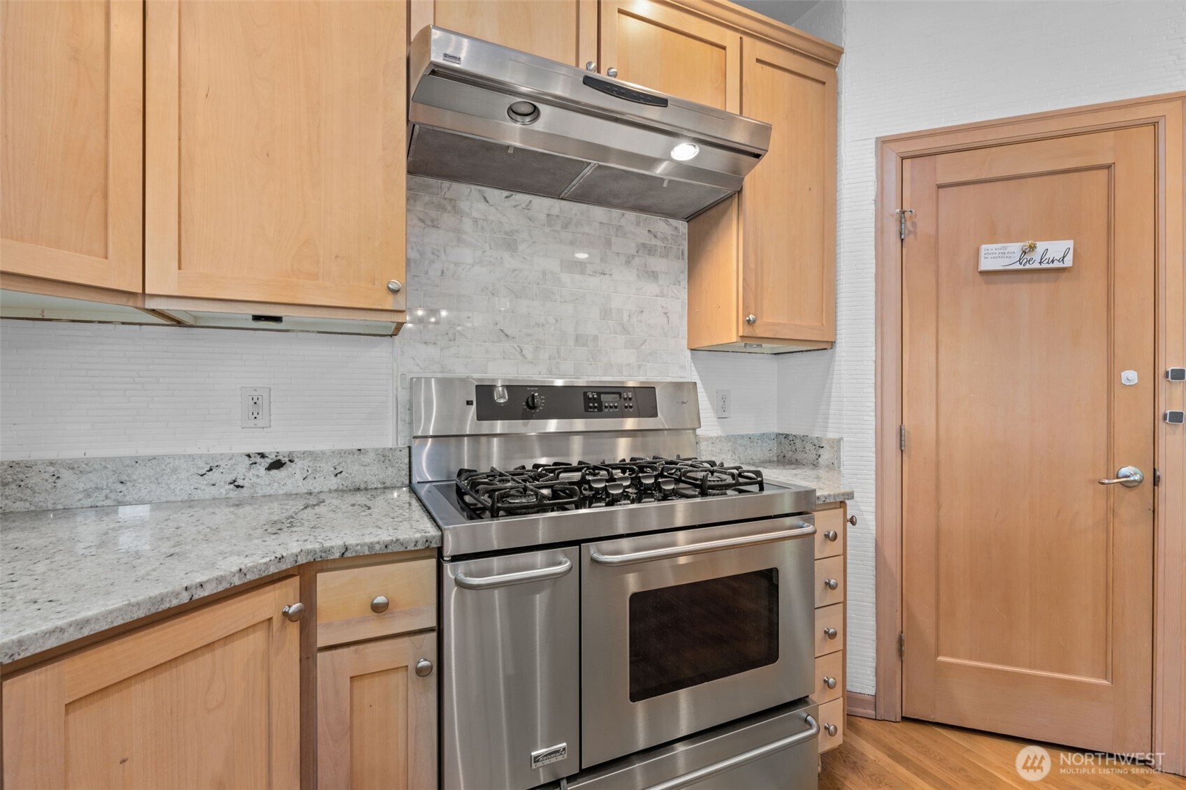 2528 Camas Avenue Northeast Renton, WA 98056 - Photo 26 of 28 a kitchen with granite countertop cabinets stainless steel appliances and a counter space