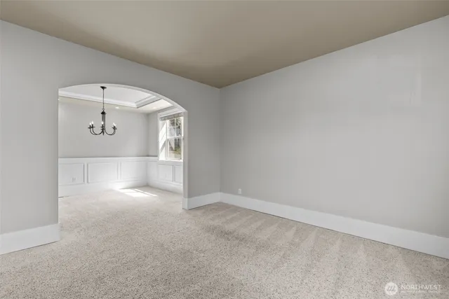a kitchen with granite countertop center island wooden floor and a large window