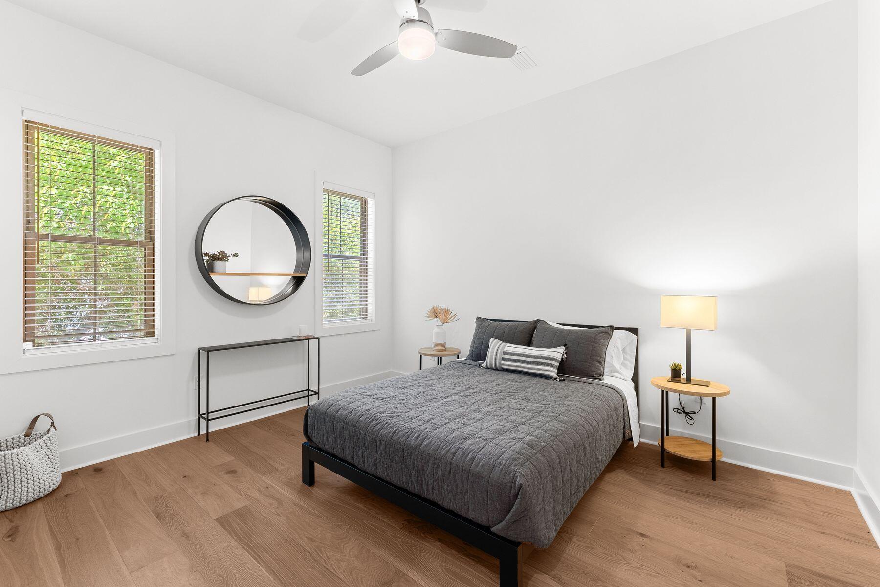 51 Morning Sun Court Santa Rosa Beach, FL 32459 - Photo 25 of 38 a bedroom with a bed and a chandelier