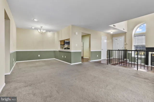 a view of an empty room with a sink