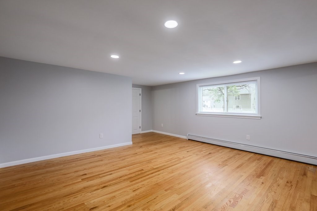19 Converse Street Palmer, MA 01069 - Photo 16 of 28 a view of an empty room with wooden floor and a window