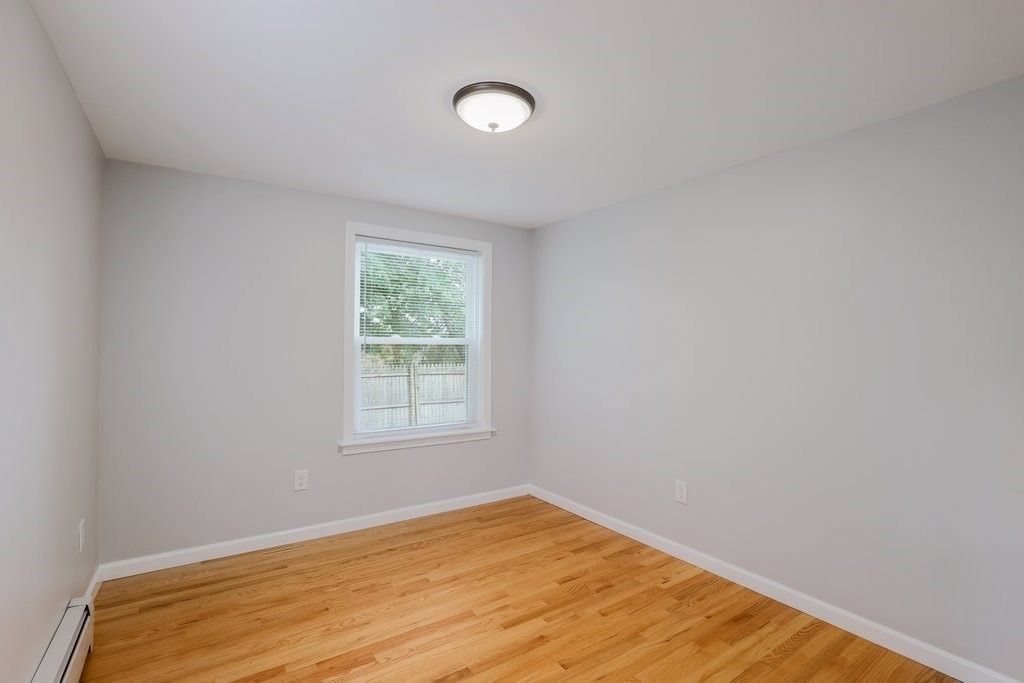 19 Converse Street Palmer, MA 01069 - Photo 18 of 28 a view of an empty room with wooden floor and a window