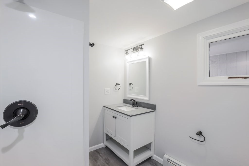 19 Converse Street Palmer, MA 01069 - Photo 19 of 28 a bathroom with a sink toilet and mirror