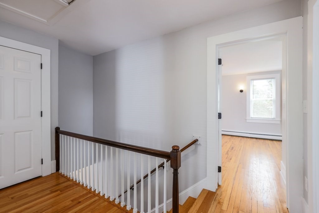 19 Converse Street Palmer, MA 01069 - Photo 28 of 28 a view of a hallway with wooden floor and staircase
