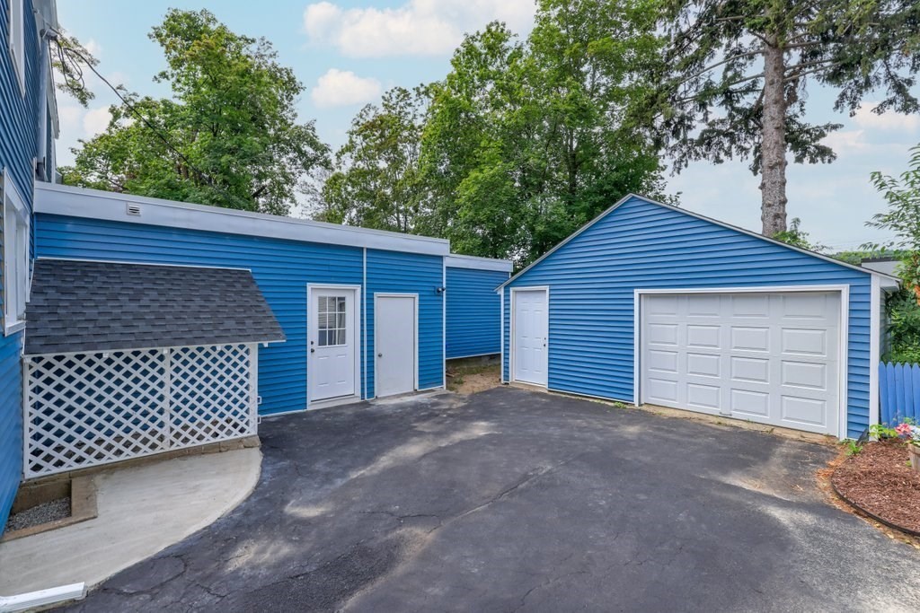 19 Converse Street Palmer, MA 01069 - Photo 3 of 28 a front view of a house with a garage