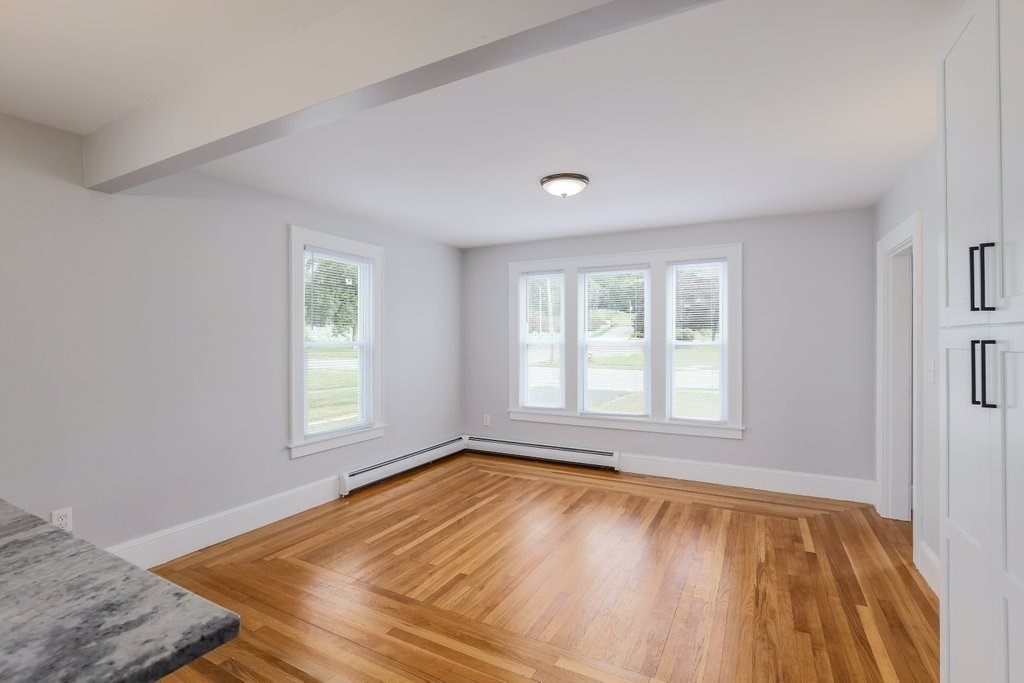 19 Converse Street Palmer, MA 01069 - Photo 9 of 28 an empty room with wooden floor and windows