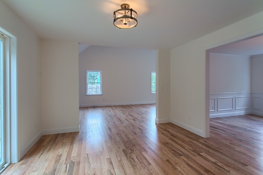 73 Meadow Road Townsend, MA 01469 - Photo 13 of 25 an empty room with wooden floor and window
