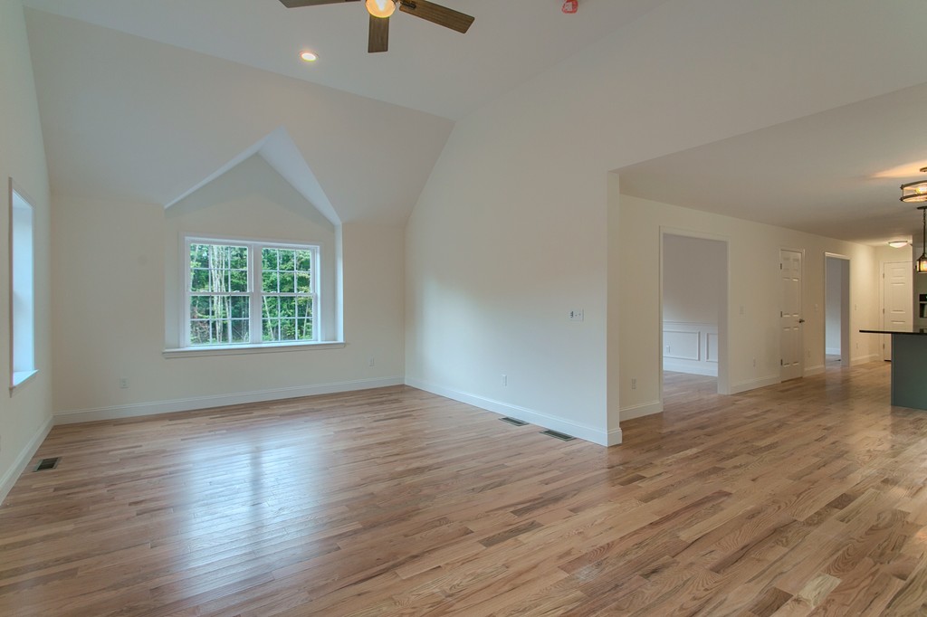 73 Meadow Road Townsend, MA 01469 - Photo 16 of 25 an empty room with wooden floor cabinet and windows