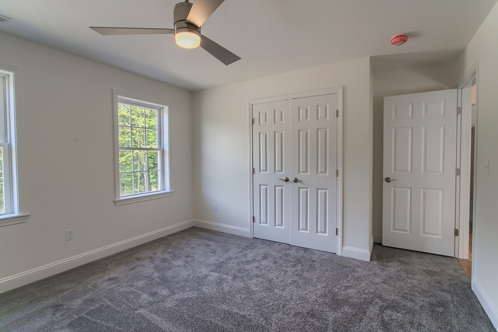 73 Meadow Road Townsend, MA 01469 - Photo 18 of 25 an empty room with windows and fan