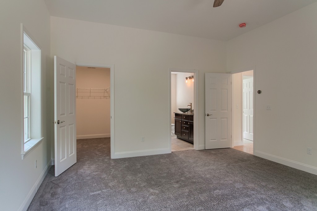 73 Meadow Road Townsend, MA 01469 - Photo 20 of 25 an empty room with closet and a bathroom