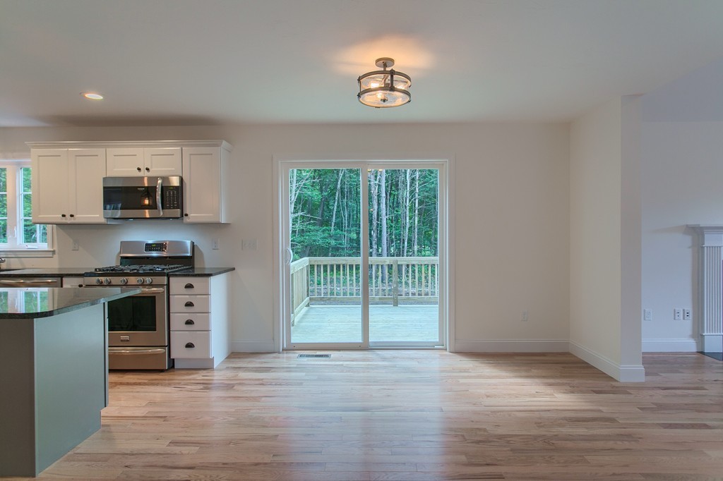 73 Meadow Road Townsend, MA 01469 - Photo 7 of 25 a kitchen with stainless steel appliances a stove top oven and a sink