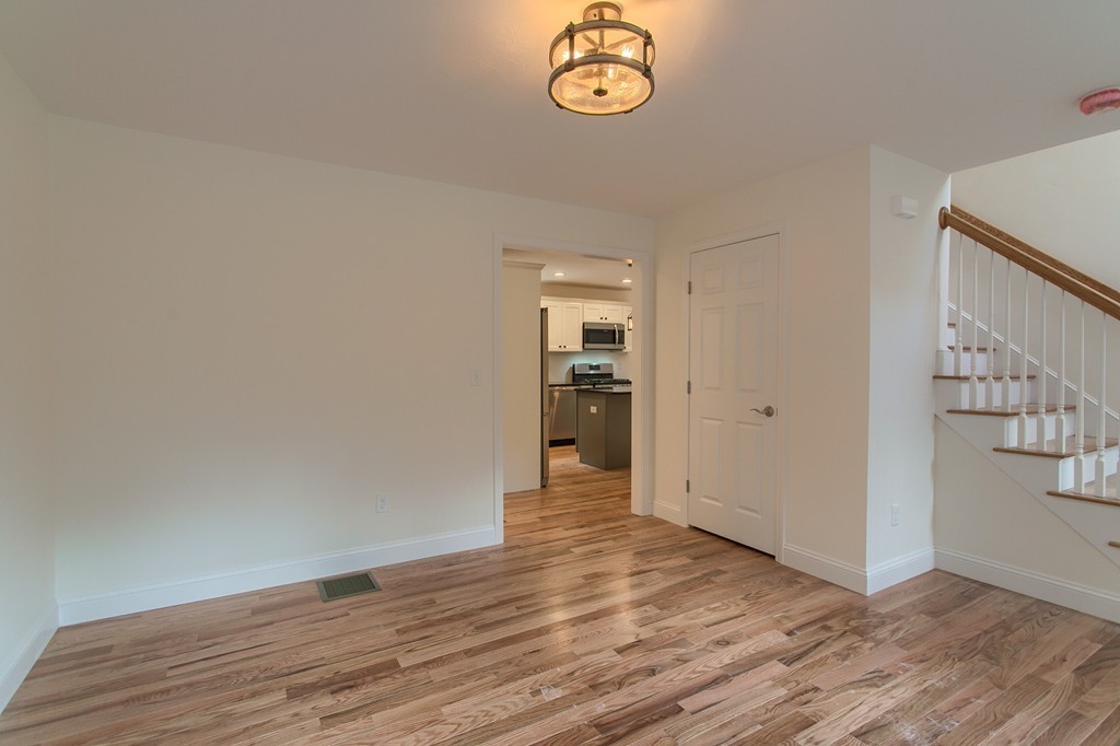 73 Meadow Road Townsend, MA 01469 - Photo 9 of 25 a view of empty room with wooden floor