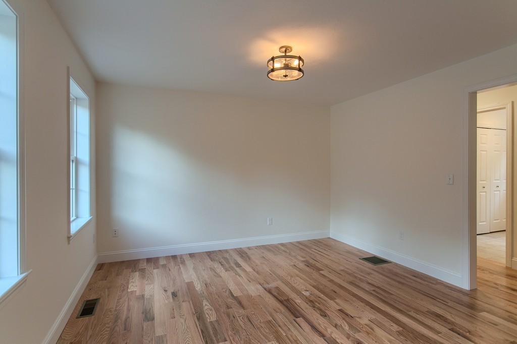 73 Meadow Road Townsend, MA 01469 - Photo 10 of 25 a view of wooden floor and window in a room