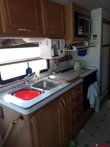 a living room with furniture and floor to ceiling window