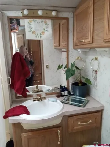 a kitchen with a refrigerator and window