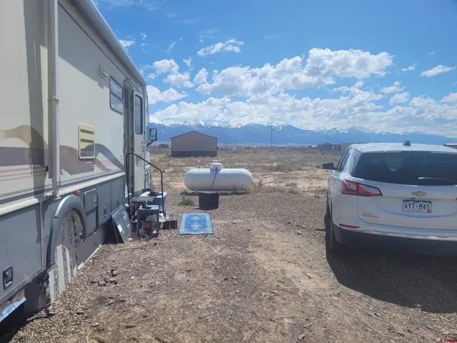 a view of a dry yard with an outdoor space