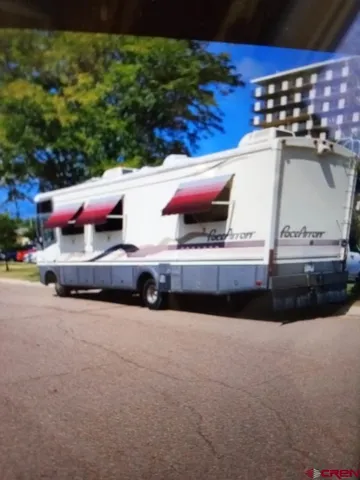 a kitchen with a sink cabinets and stainless steel appliances