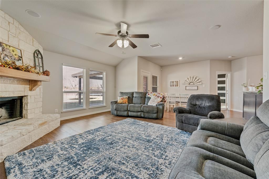 343 Amber Lane Nevada, TX 75173 - Photo 15 of 33 a living room with furniture and a fireplace
