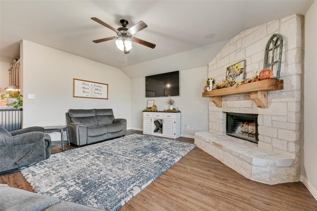 343 Amber Lane Nevada, TX 75173 - Photo 16 of 33 a living room with furniture and a fireplace