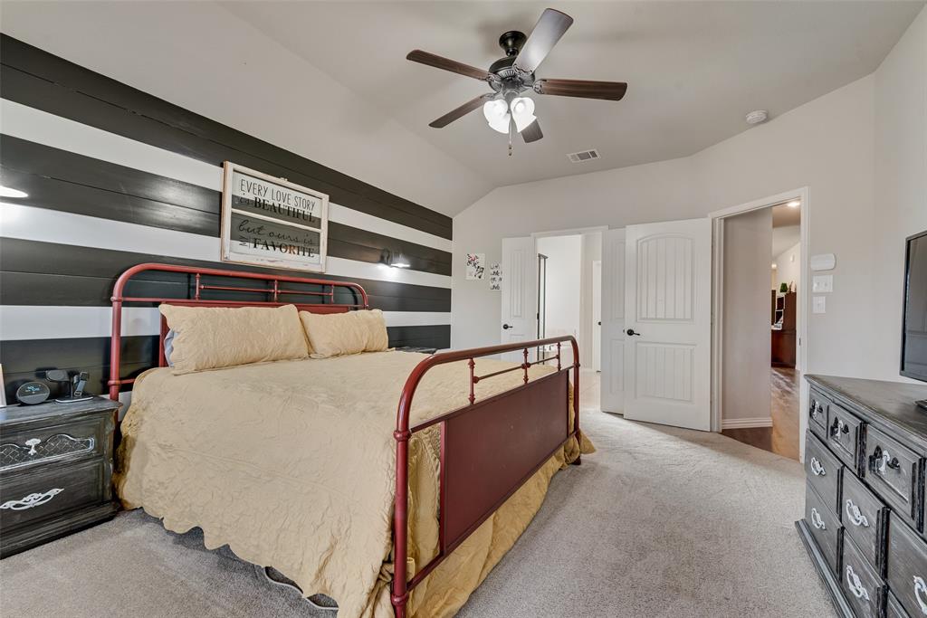 343 Amber Lane Nevada, TX 75173 - Photo 20 of 33 a bed room with a bed and a ceiling fan