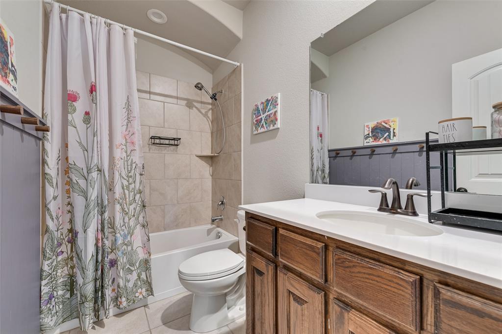 343 Amber Lane Nevada, TX 75173 - Photo 26 of 33 a bathroom with a sink toilet vanity and shower